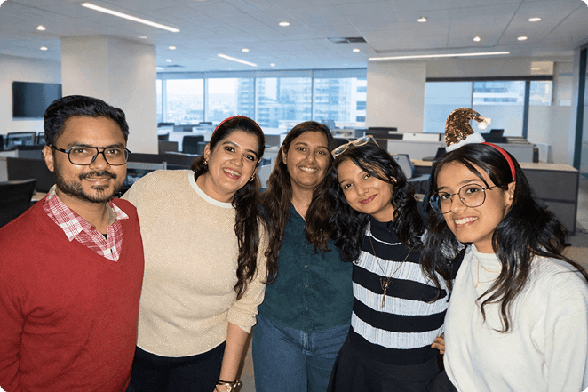 Modifyed team members smiling together in the office